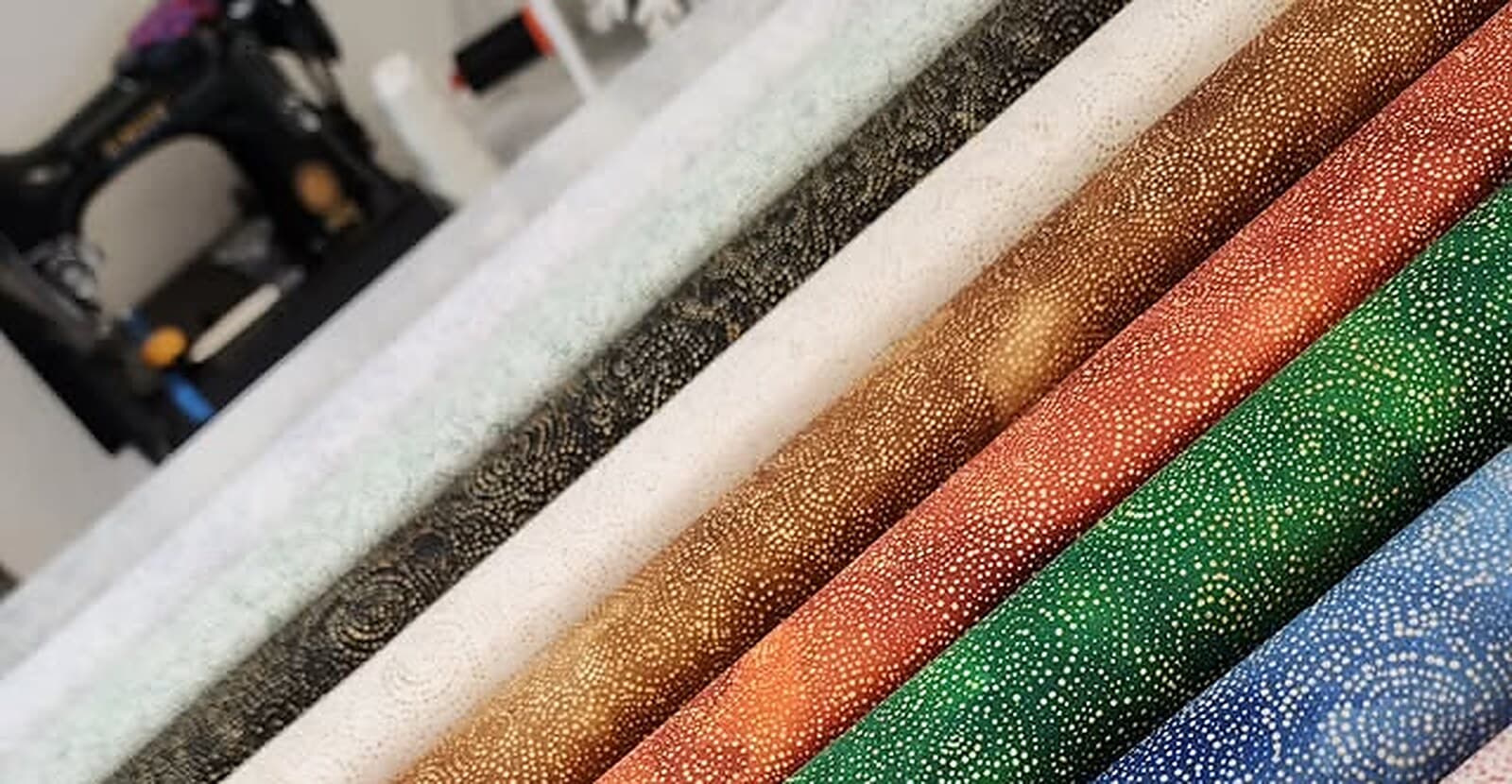 Bolts of fabric on the shelves at a Piece of Alaska Quilt Co.