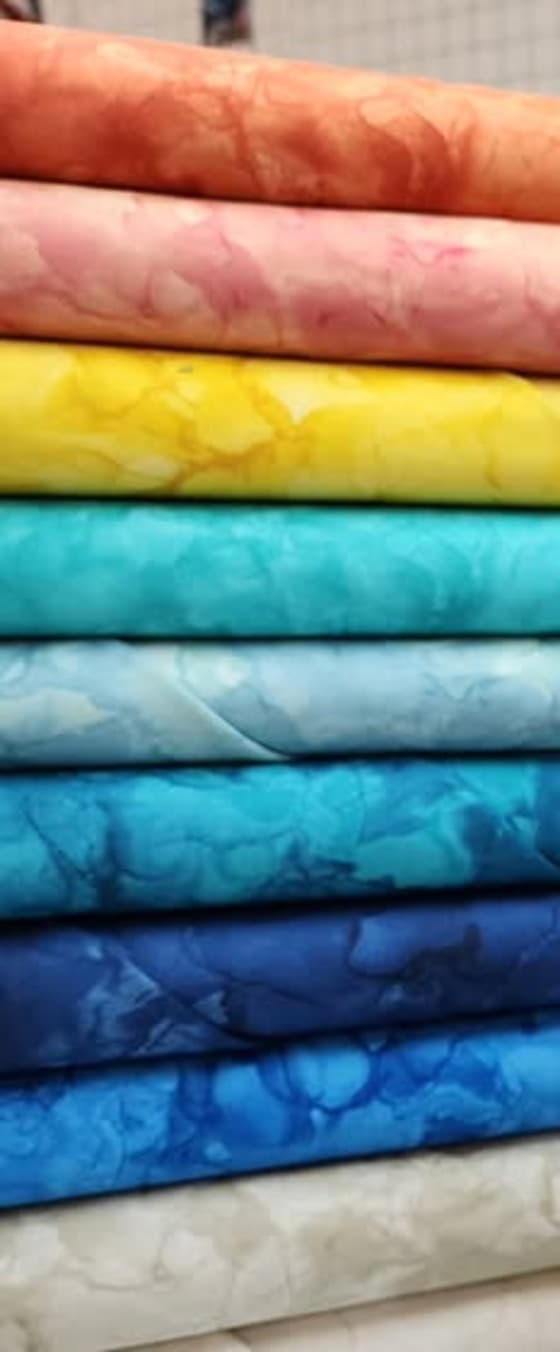 Stacked blender fabrics in the shop